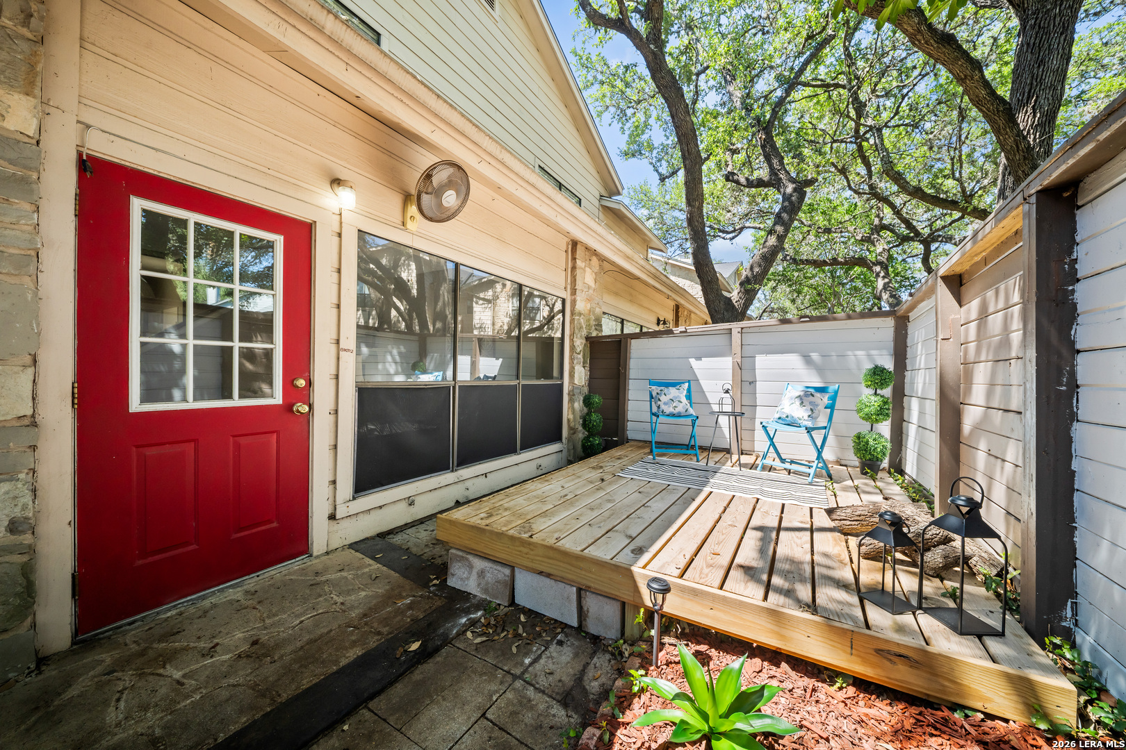 829 West Bitters Road, Unit 502 San Antonio, TX 78216 - Photo 23 of 29 a view of a patio with table and chairs and wooden fence