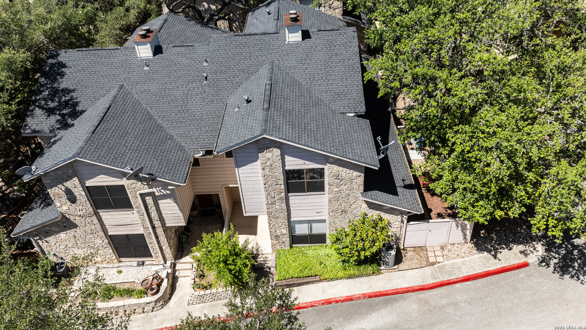 829 West Bitters Road, Unit 502 San Antonio, TX 78216 - Photo 26 of 29 an aerial view of a house with a yard and potted plants