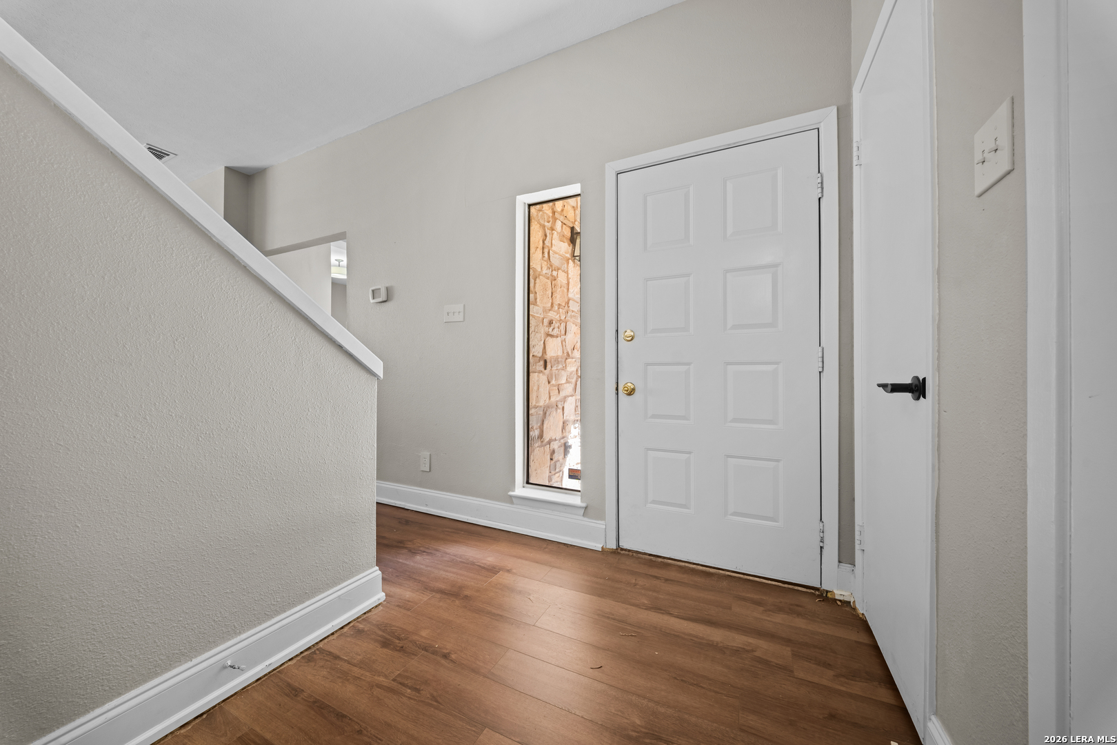 829 West Bitters Road, Unit 502 San Antonio, TX 78216 - Photo 29 of 29 a view of an empty room with wooden floor and stairs
