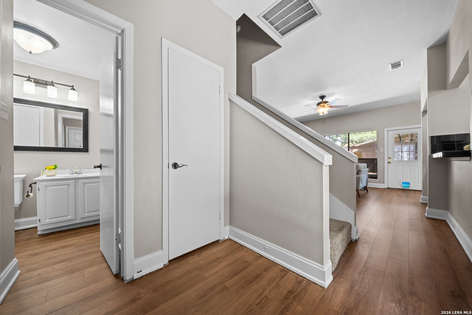 829 West Bitters Road, Unit 502 San Antonio, TX 78216 - Photo 4 of 29 a view of a hallway with an empty room and wooden floor