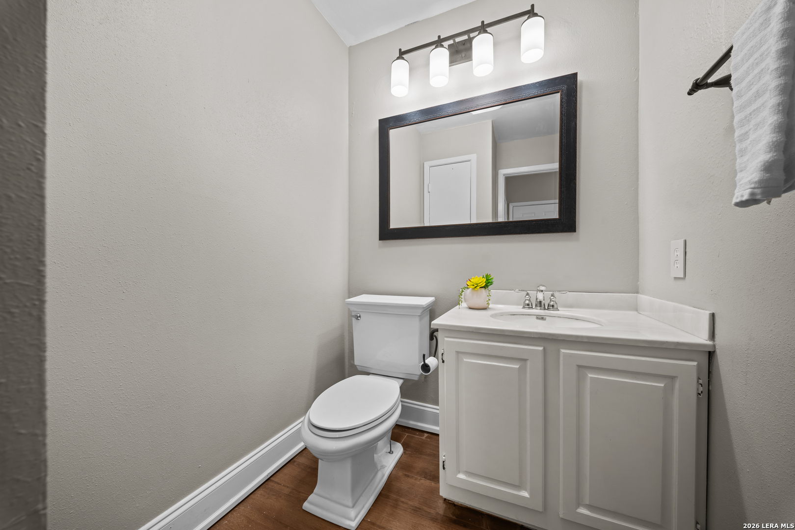 829 West Bitters Road, Unit 502 San Antonio, TX 78216 - Photo 5 of 29 a bathroom with a toilet a sink and mirror
