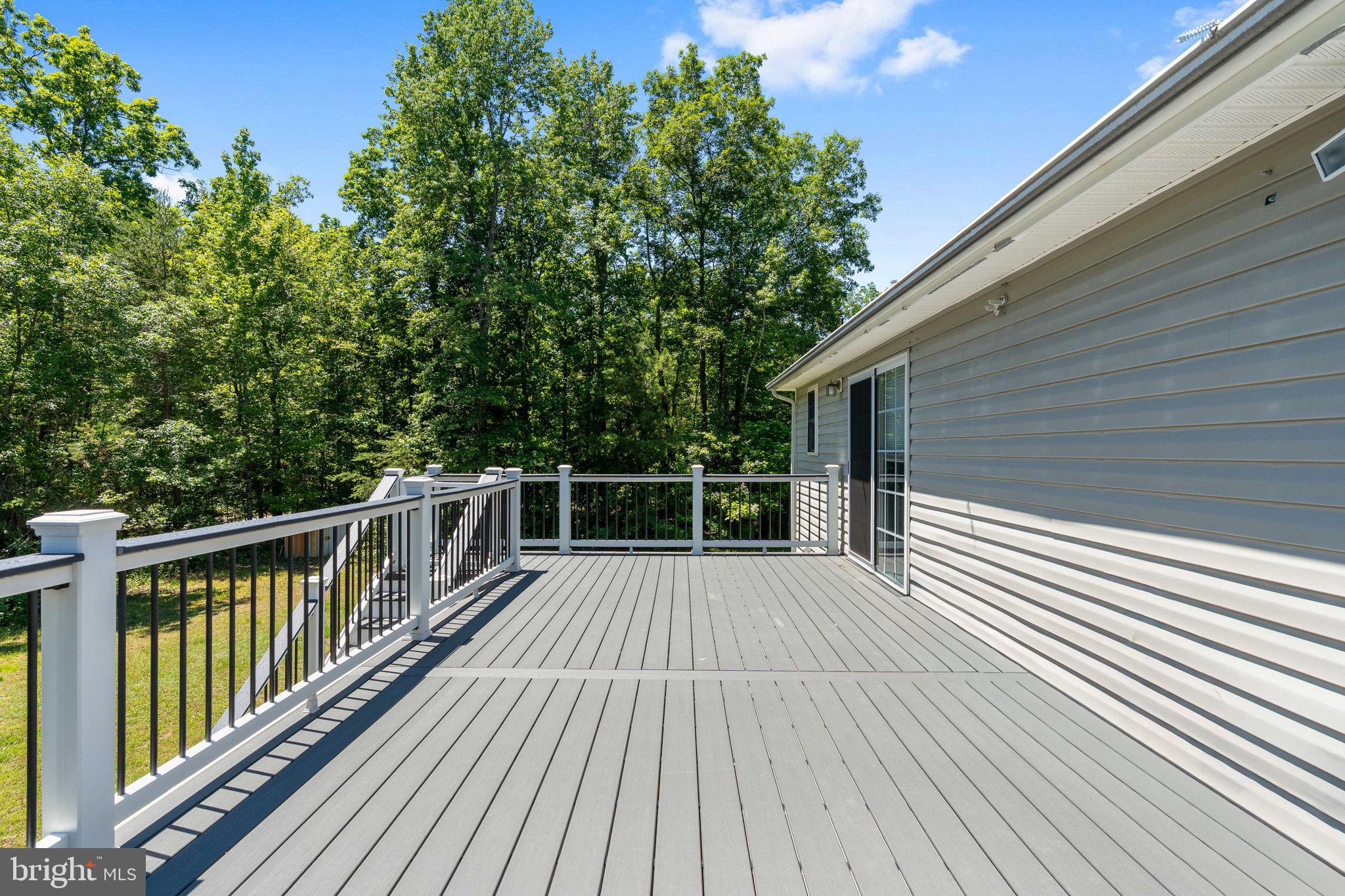 8009 Burrell Road Fredericksburg, VA 22407 - Photo 51 of 66 Serene deck overlooking lush greenery.