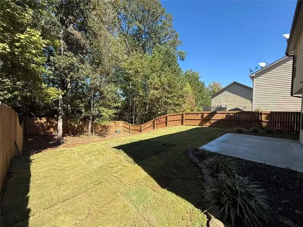 a view of swimming pool with a yard