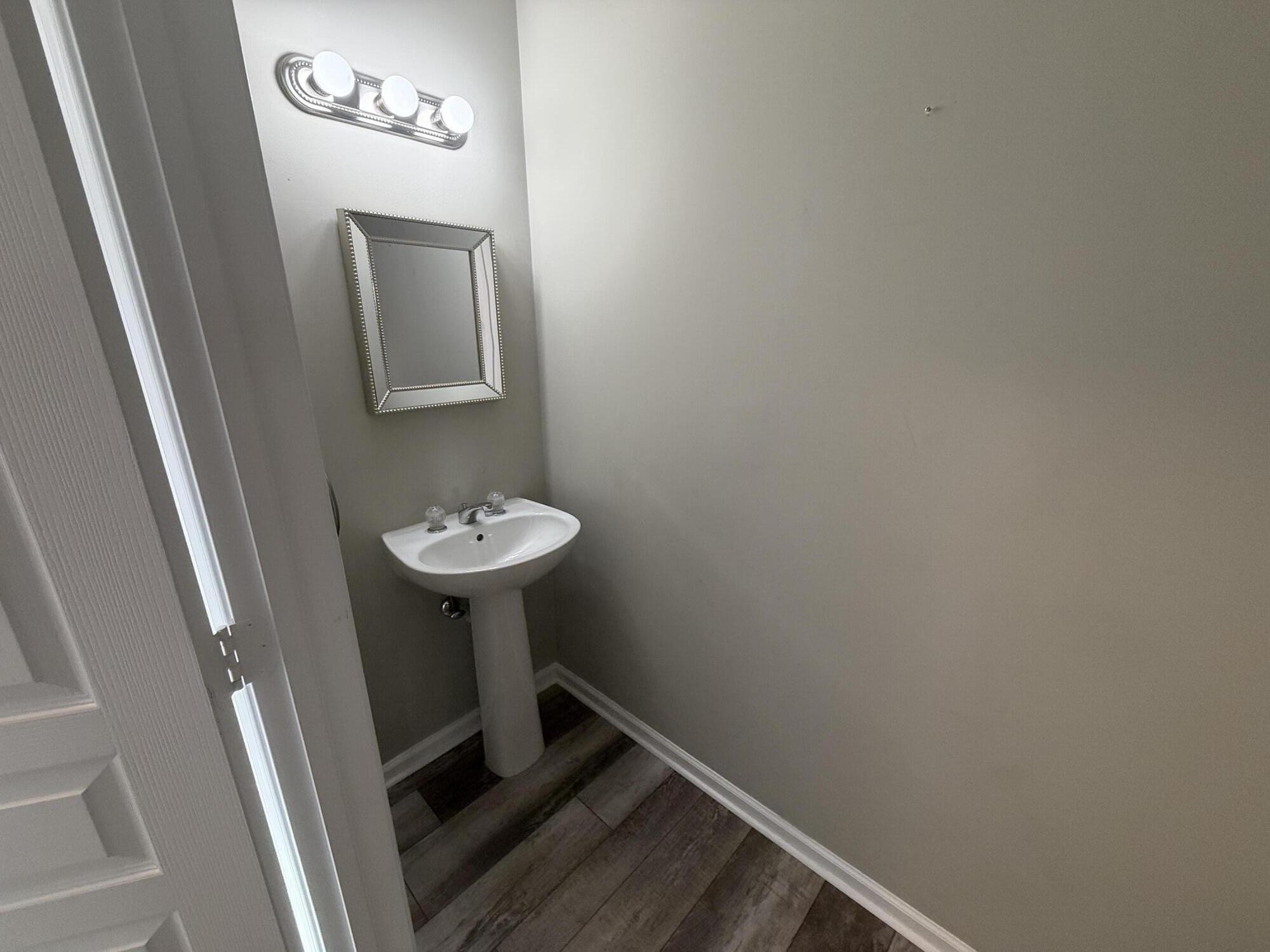 21543 St Andrews Grand Circle, Unit 41 Boca Raton, FL 33486 - Photo 11 of 27 a bathroom with a sink a mirror and a toilet