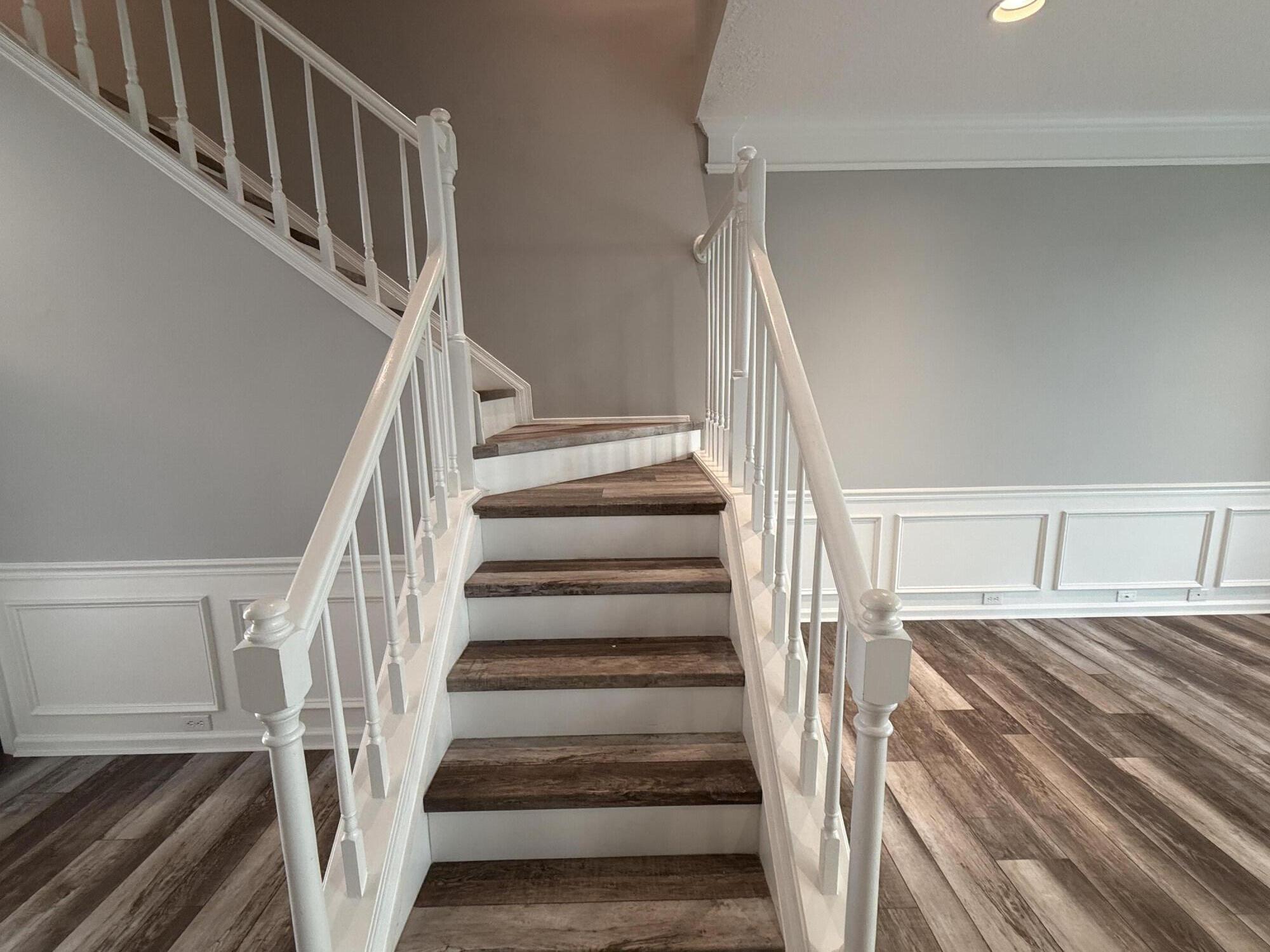 21543 St Andrews Grand Circle, Unit 41 Boca Raton, FL 33486 - Photo 13 of 27 a view of staircase with wooden floor and white walls