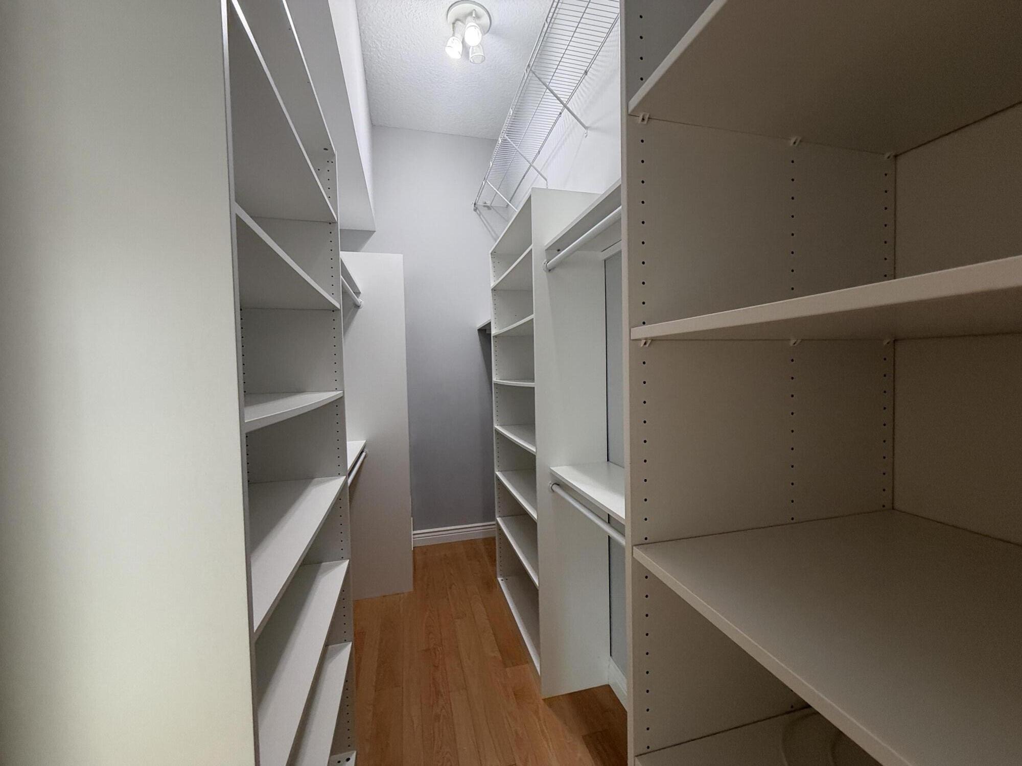 21543 St Andrews Grand Circle, Unit 41 Boca Raton, FL 33486 - Photo 19 of 27 a view of an empty walk in closet