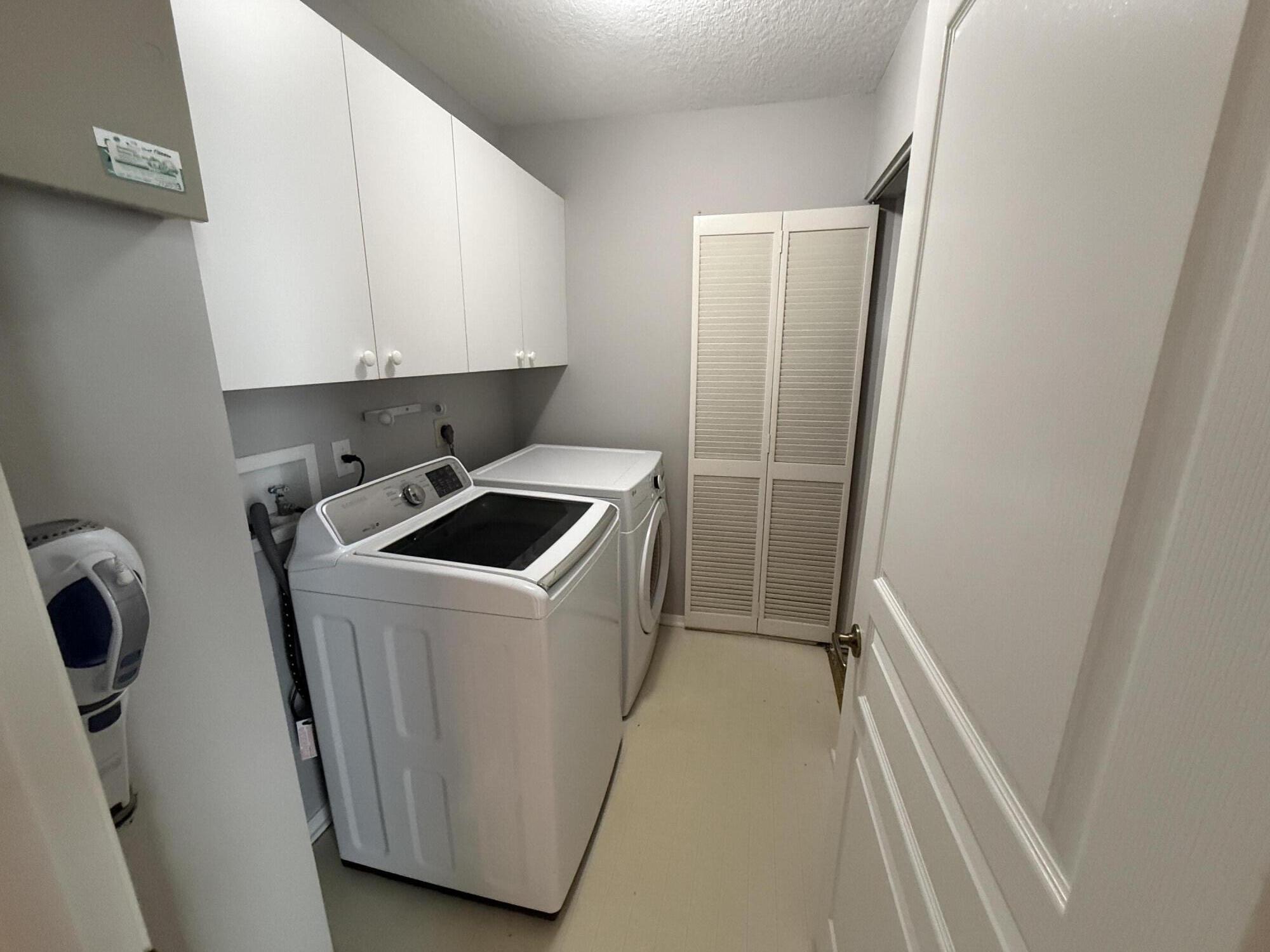 21543 St Andrews Grand Circle, Unit 41 Boca Raton, FL 33486 - Photo 20 of 27 a utility room with dryer and washer