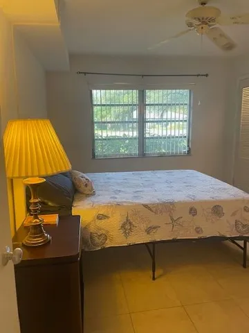 a bathroom with a sink and a mirror with toilet