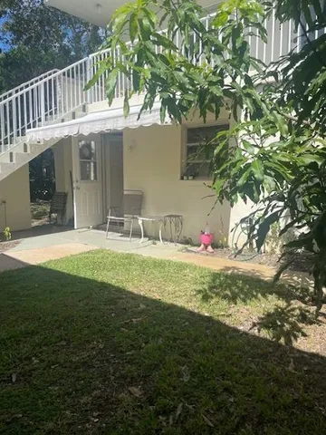 a view of yard from deck with outdoor seating