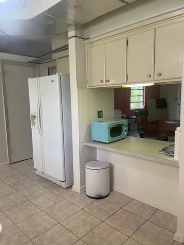 a kitchen with a sink and a stove top oven