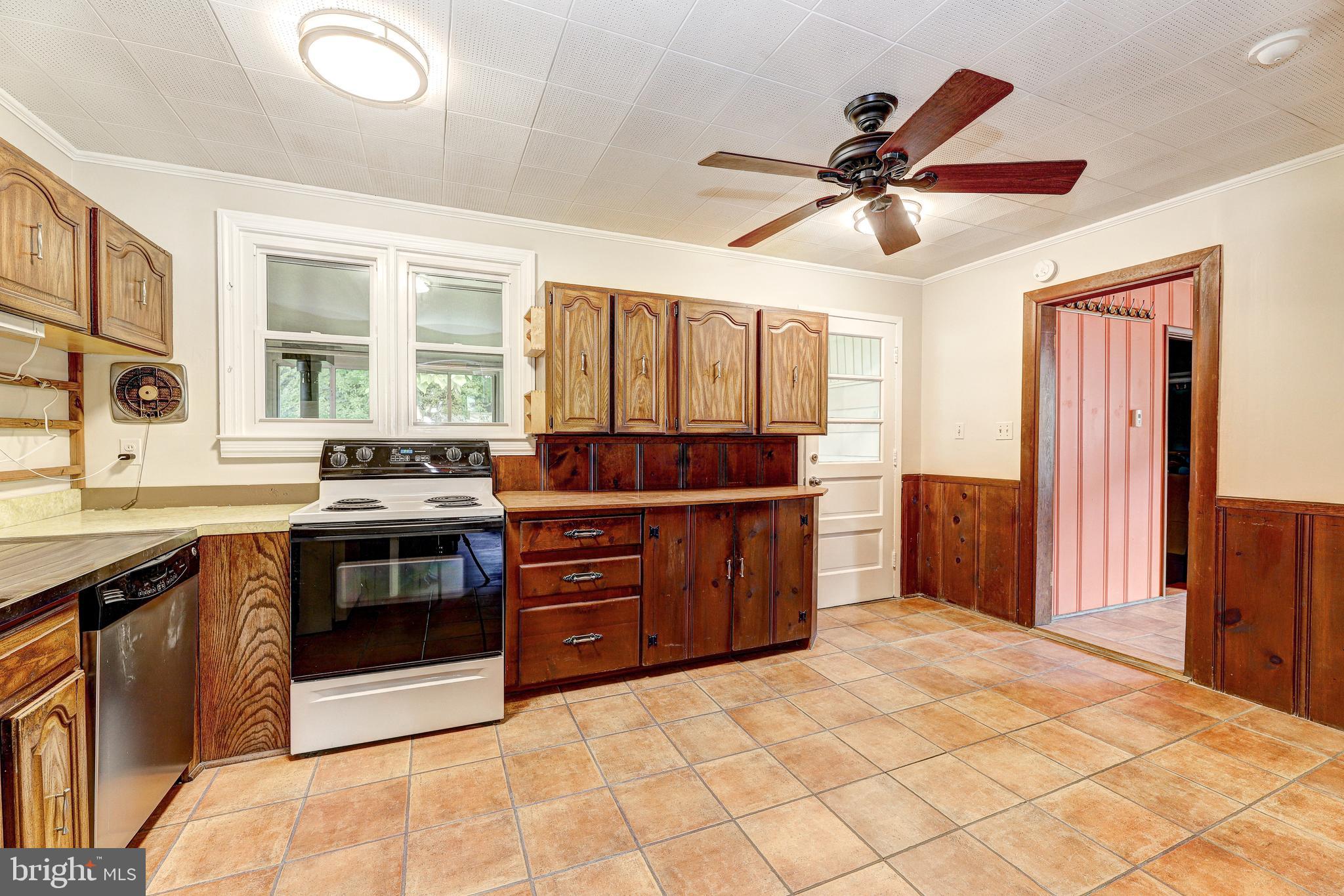 7500 Rocksham Drive Towson, MD 21286 - Photo 5 of 26 a kitchen with a stove and a sink