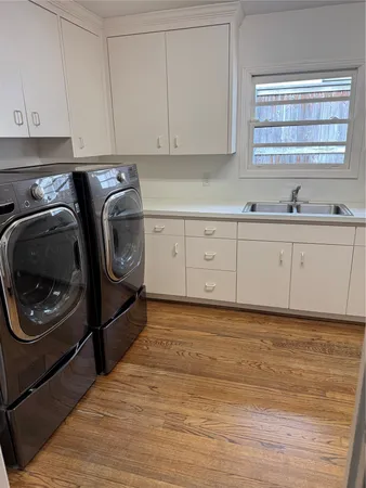 a kitchen with a sink and cabinets