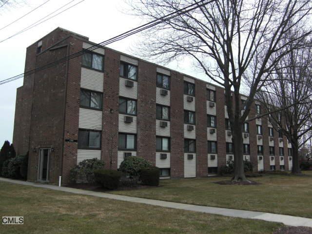 1168 Main Street, Unit C9 Stratford, CT 06615 - Photo 1 of 1 a front view of a building with garden