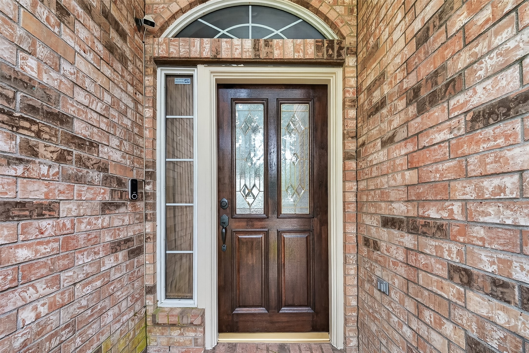 14308 Rocky Briar Lane Rosharon, TX 77583 - Photo 4 of 46 a view of a wooden door with a door