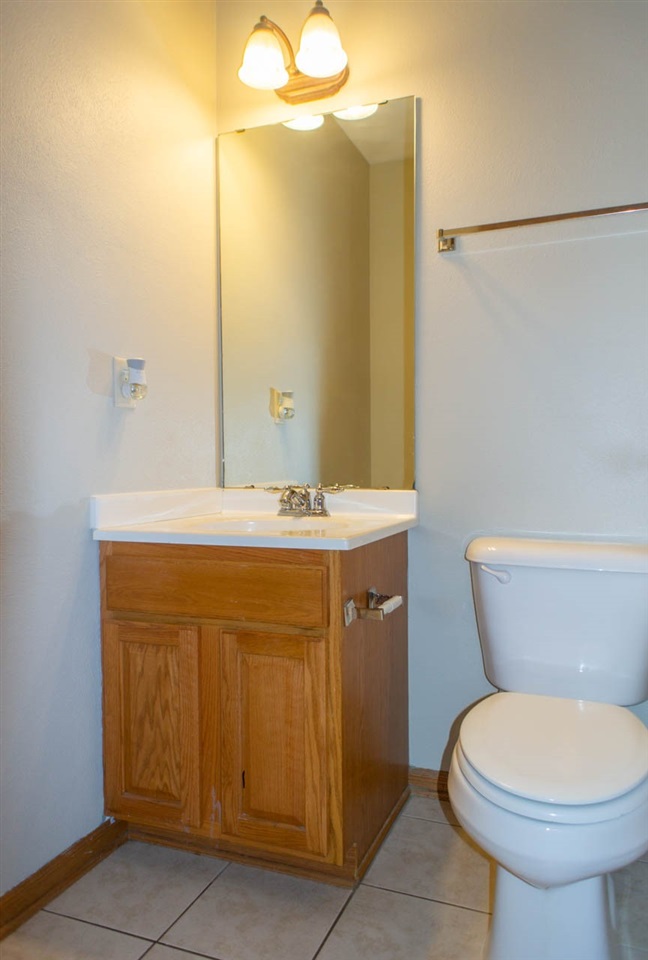 9915 Rambouillet Ridge Roscoe, IL 61073 - Photo 17 of 35 a bathroom with a sink mirror vanity and toilet
