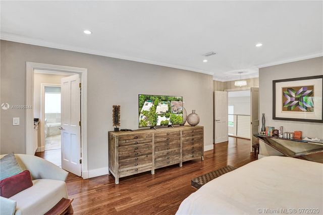 a view of yard with swimming pool and trees in the background