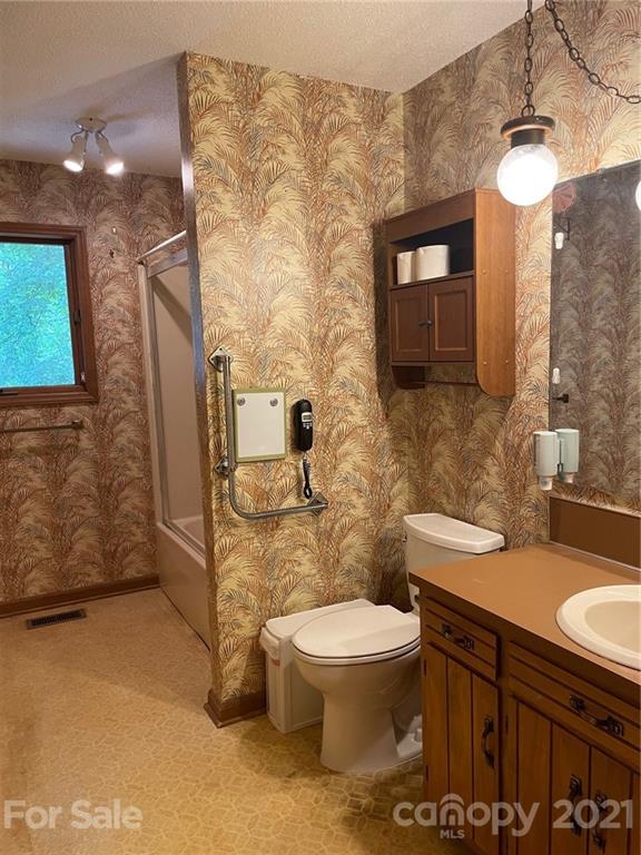 4797 Asbury Church Road Lincolnton, NC 28092 - Photo 11 of 19 a bathroom with a granite countertop toilet sink and mirror