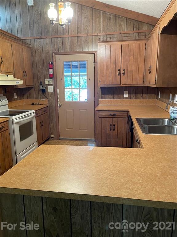4797 Asbury Church Road Lincolnton, NC 28092 - Photo 14 of 19 a kitchen with a sink a stove and cabinets