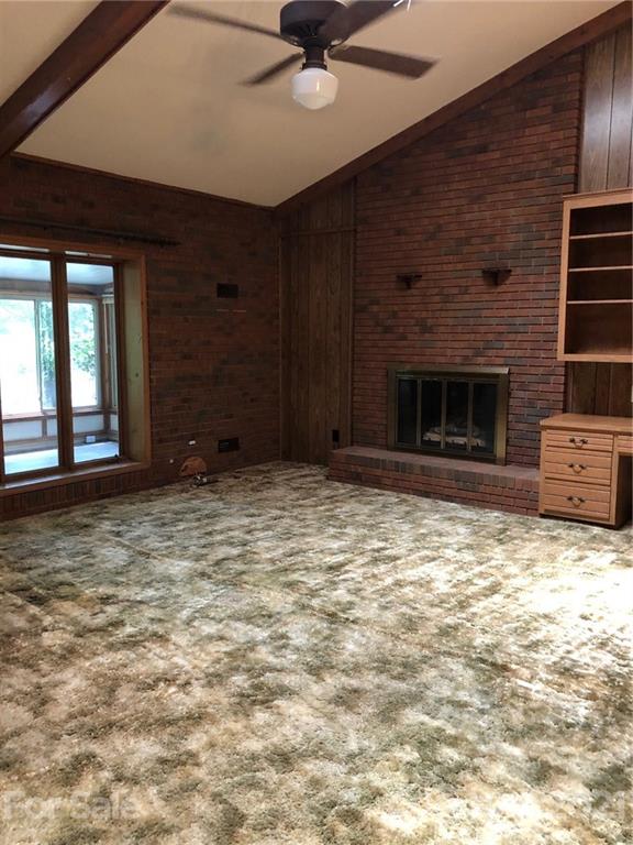 4797 Asbury Church Road Lincolnton, NC 28092 - Photo 16 of 19 a view of an empty room with a fireplace and a window