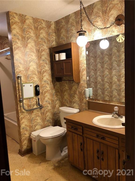 4797 Asbury Church Road Lincolnton, NC 28092 - Photo 18 of 19 a bathroom with a sink a toilet and shower