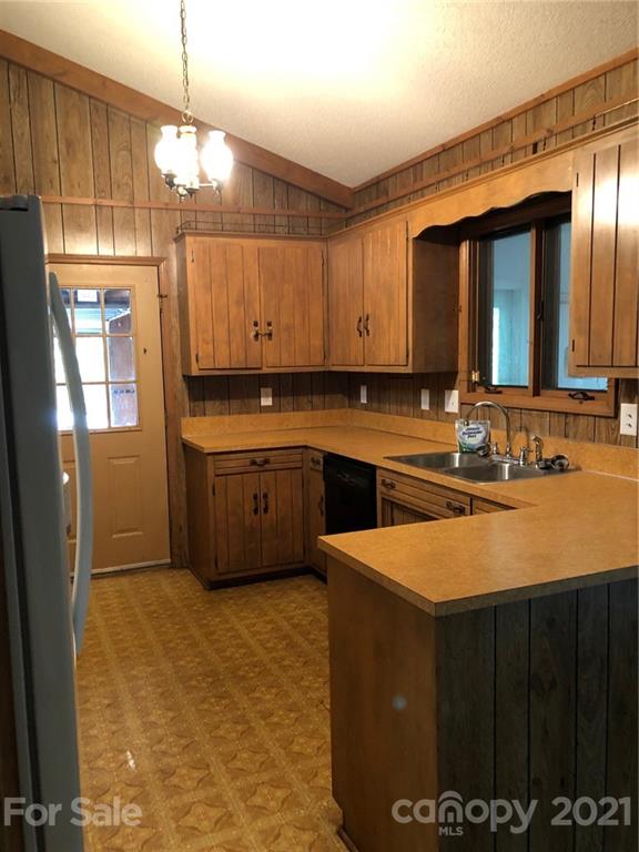 4797 Asbury Church Road Lincolnton, NC 28092 - Photo 19 of 19 a kitchen with stainless steel appliances granite countertop a sink counter space cabinets and a window