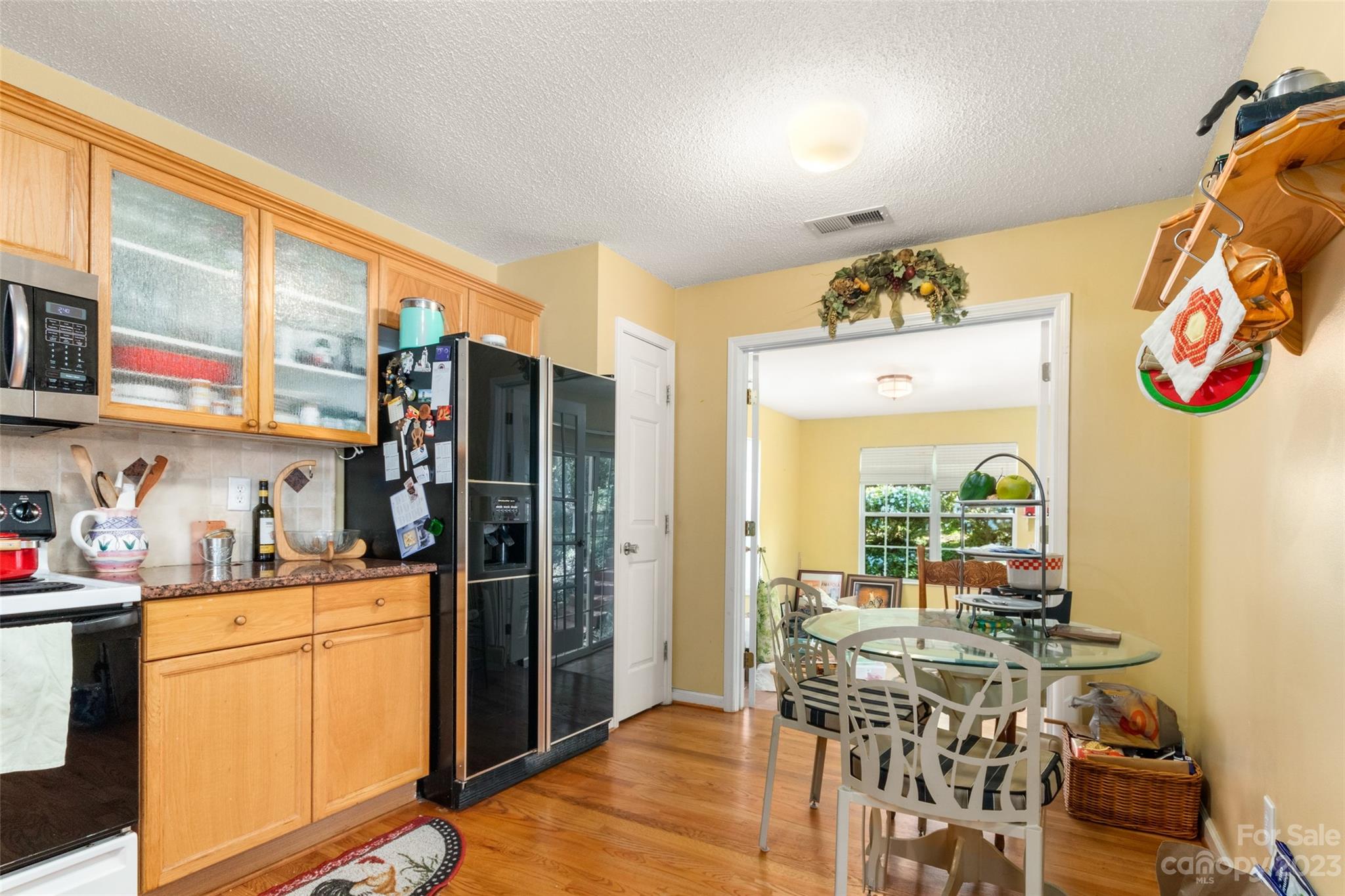912 Cadogan Court Fort Mill, SC 29708 - Photo 15 of 26 a kitchen with stainless steel appliances granite countertop a refrigerator and a view of living room
