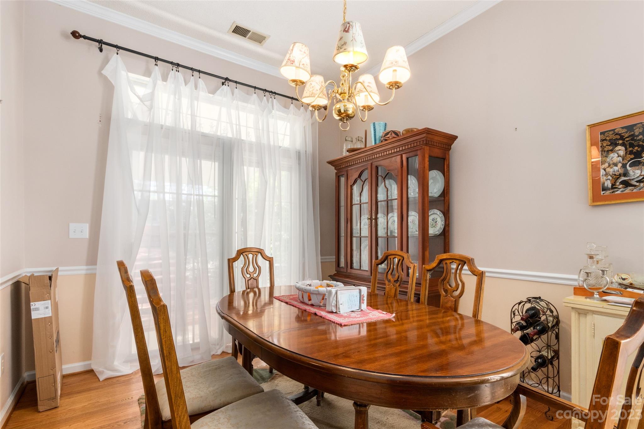 912 Cadogan Court Fort Mill, SC 29708 - Photo 17 of 26 a view of a dining room with furniture and chandelier