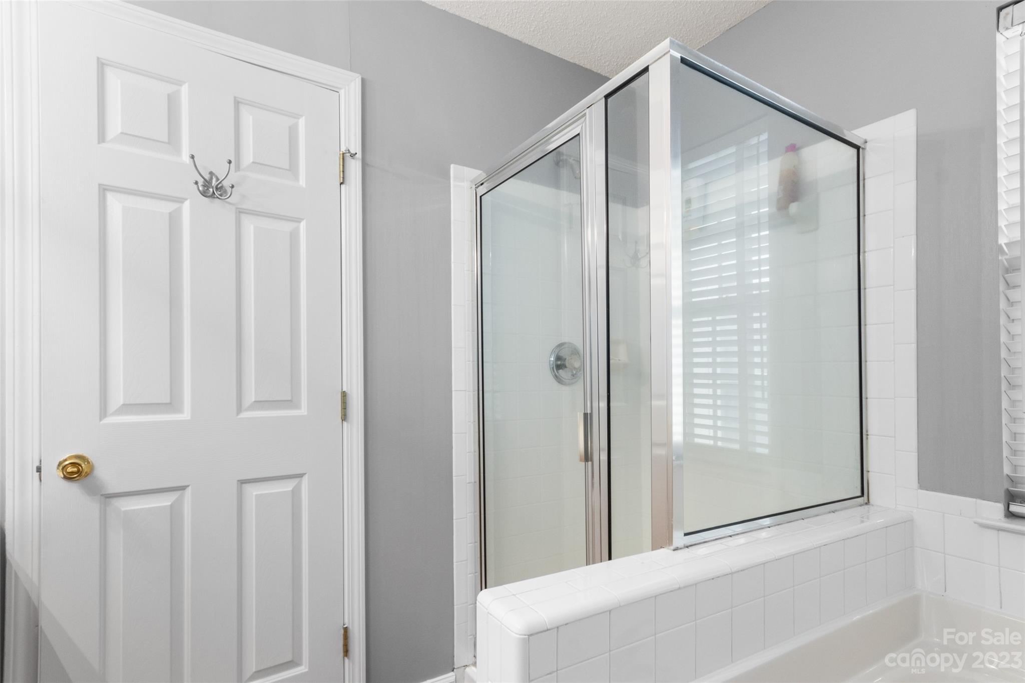 912 Cadogan Court Fort Mill, SC 29708 - Photo 10 of 26 a bathroom with a shower and a tub