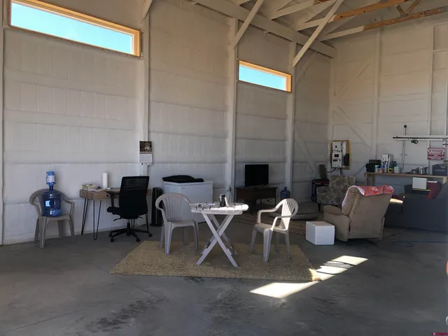 a living room with furniture a fireplace and a table