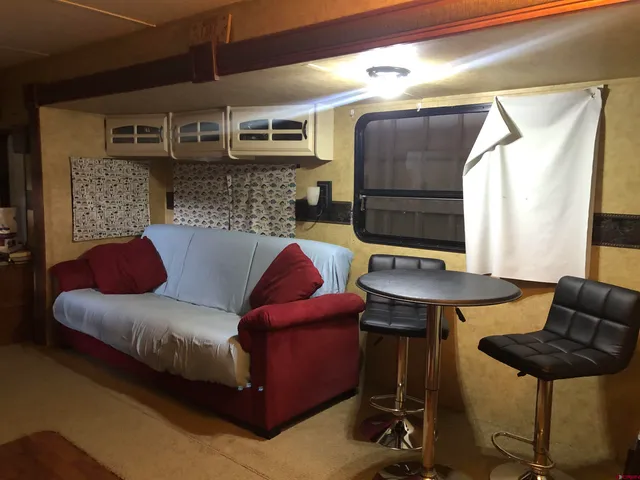 a living room with furniture and a rug