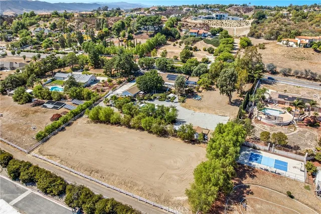 a view of a swimming pool with a yard