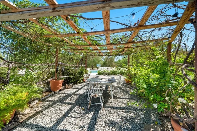 a view of a house with a yard porch and sitting area