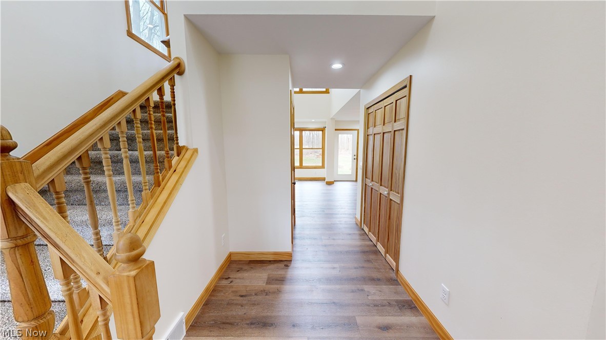 15548 Trask Road Thompson, OH 44086 - Photo 4 of 31 Hallway featuring wood-type flooring