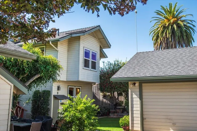 a view of house with trees in front of it