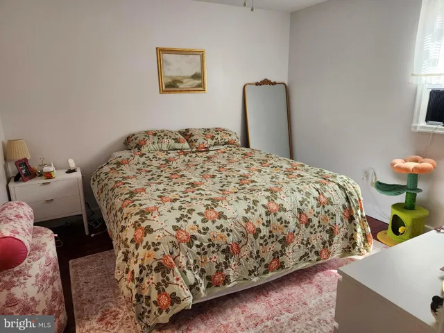 a bedroom with a bed and a mirror