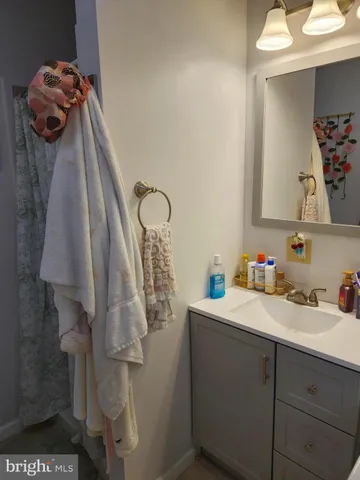 a bathroom with a sink and mirror