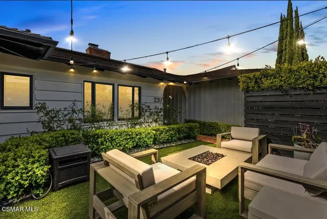 a view of an outdoor sitting area with furniture