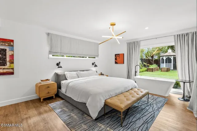 a bed room with a bed and a window