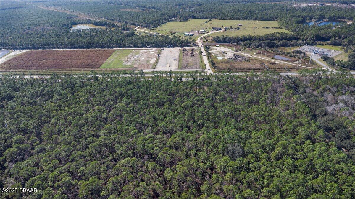 10090 U.S. Rte 1 Ormond Beach, FL 32174 - Photo 22 of 38 an aerial view of a house with a yard