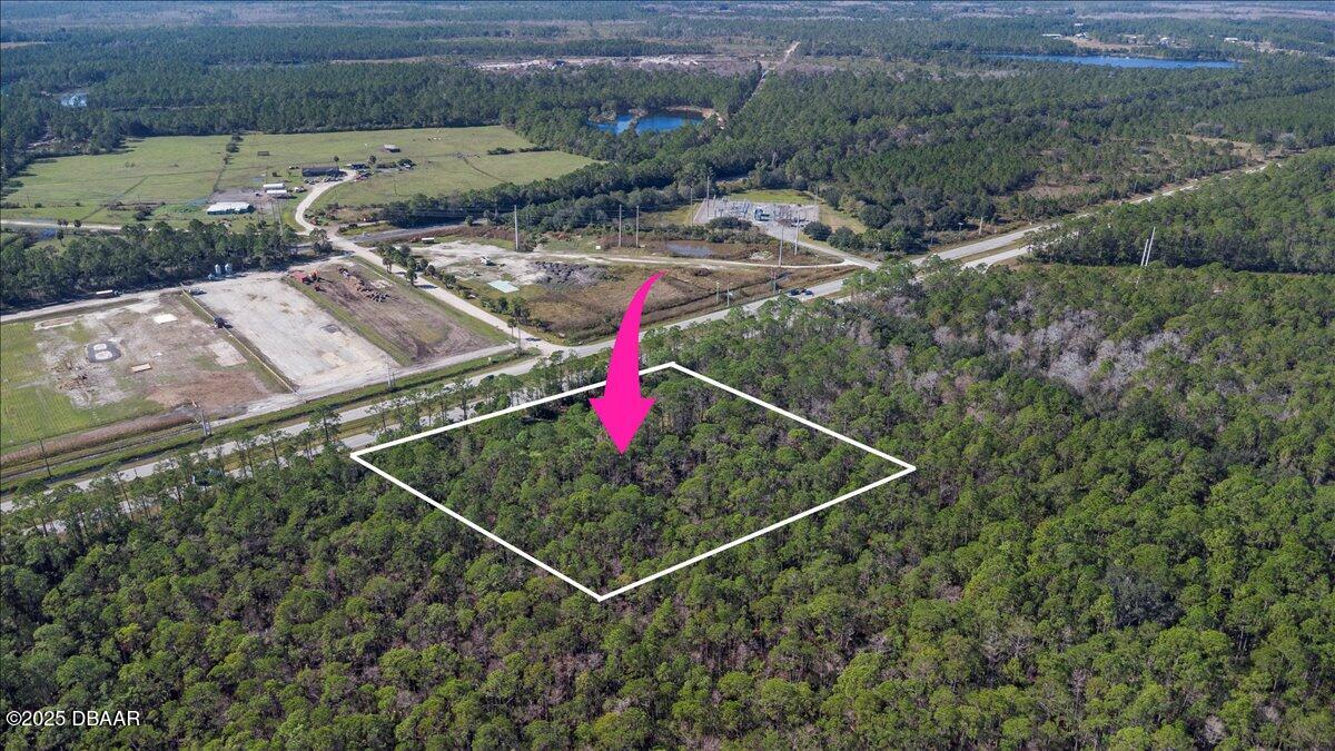 10090 U.S. Rte 1 Ormond Beach, FL 32174 - Photo 23 of 38 a backyard of a house with a yard and outdoor seating