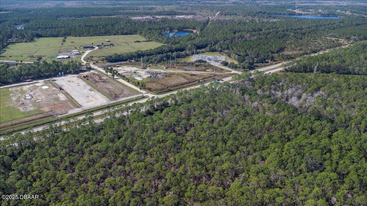 10090 U.S. Rte 1 Ormond Beach, FL 32174 - Photo 24 of 38 an aerial view of a house with a yard