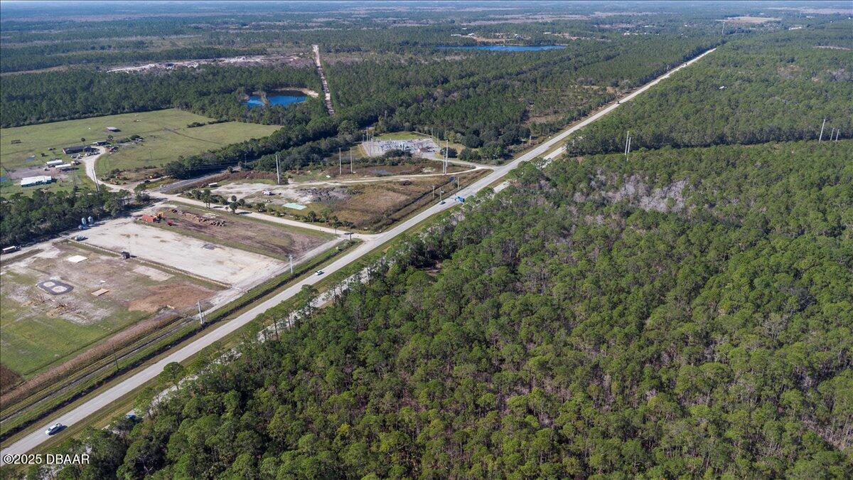 10090 U.S. Rte 1 Ormond Beach, FL 32174 - Photo 27 of 38 a view of a yard with a wooden fence