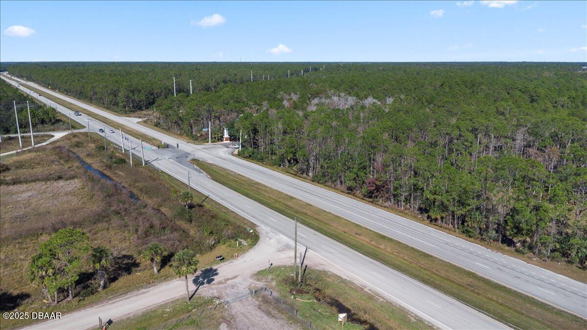 10090 U.S. Rte 1 Ormond Beach, FL 32174 - Photo 32 of 38 a view of a forest from a balcony