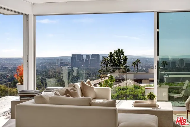 a outdoor living space with furniture and a flat screen tv