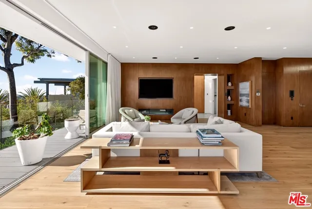 a view of a balcony with flower plants