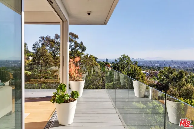a view of a balcony with an ocean view