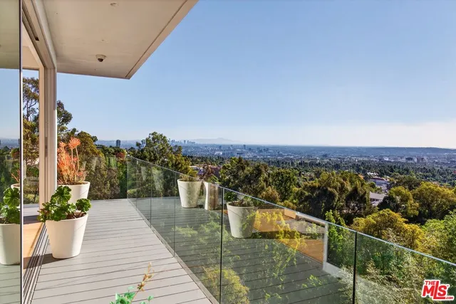 a terrace with outdoor seating and plants