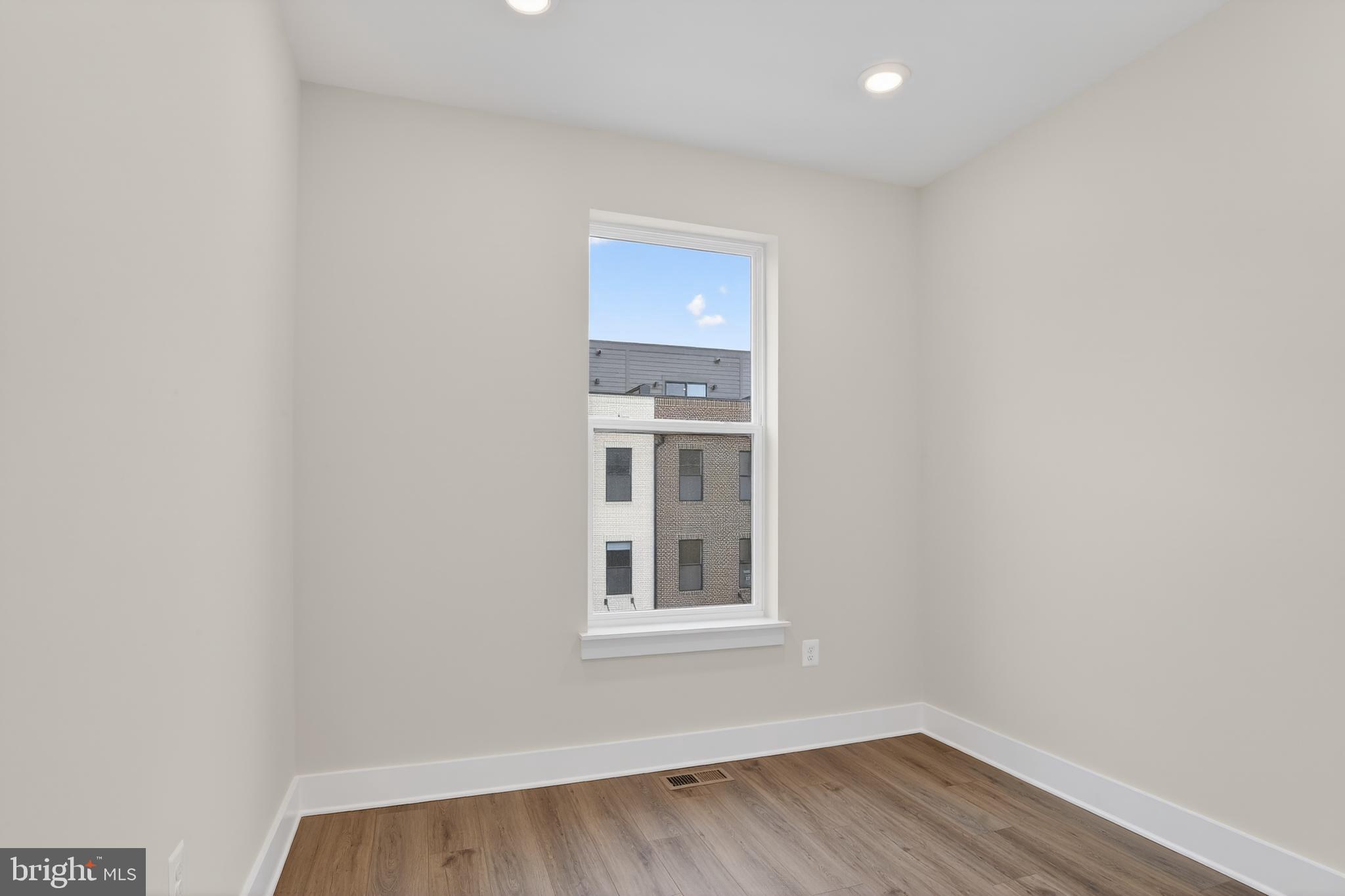 2710 Light Street Baltimore, MD 21230 - Photo 14 of 24 a view of a room with wooden floor and window