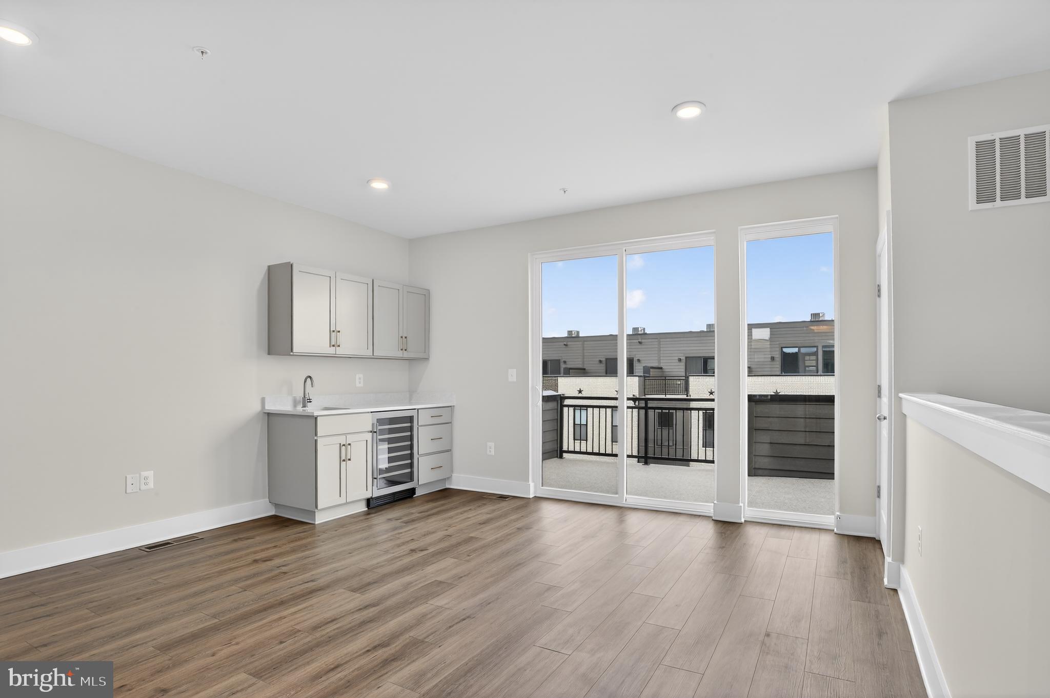 2710 Light Street Baltimore, MD 21230 - Photo 16 of 24 a kitchen with a refrigerator and cabinets