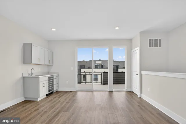 a kitchen with a refrigerator and cabinets